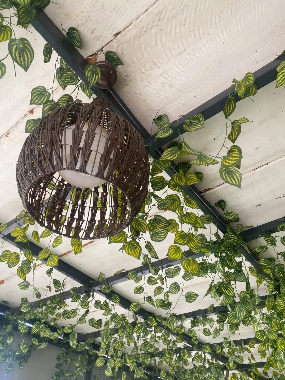 Afro-fusion styling with mudcloth cushions, raffia and clay vessels